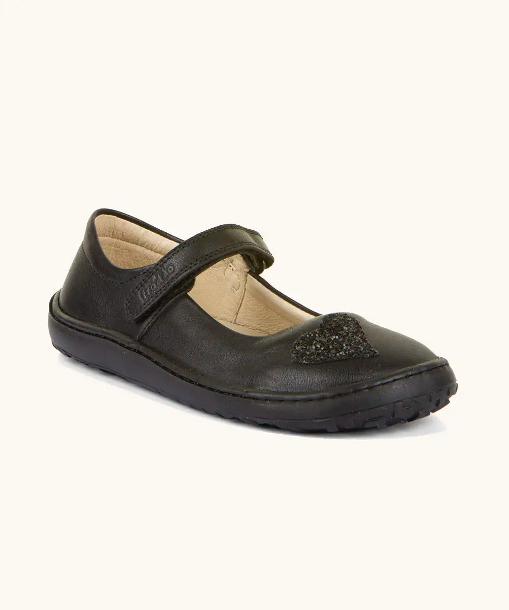 Froddo barefoot kids natural black leather school shoe. A dolly shoe with a velcro fastener and heart decoration on the front