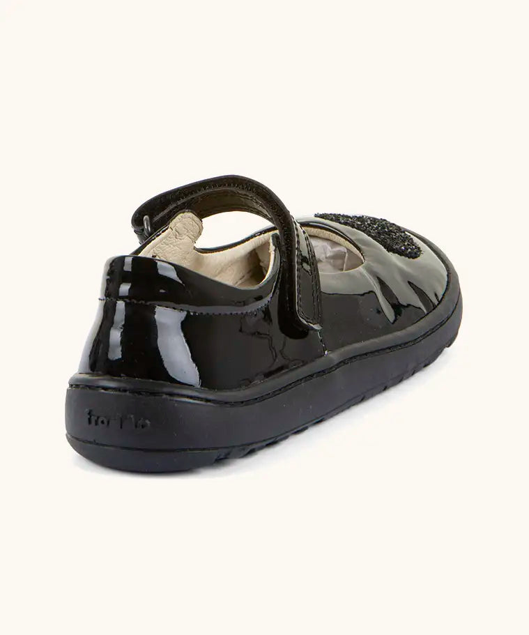 Back of Froddo barefoot kids black patent school shoe. A dolly shoe with a small padded ankle support