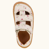 Top view of Froddo barefoot children's sandal in pale pink with flowers showing the 2 velcro strap fastener and insole detail