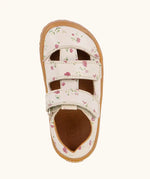 Top view of Froddo barefoot children's sandal in pale pink with flowers showing the 2 velcro strap fastener and insole detail
