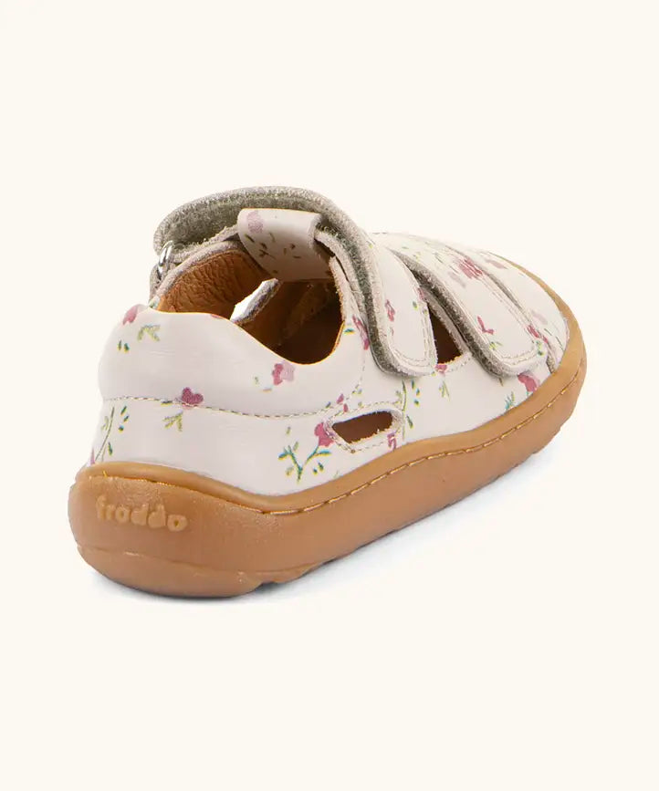 Back of the Froddo barefoot children's sandal in pink with flowers showing the padded ankle support and brown grippy sole