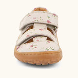 Front of the Froddo barefoot children's sandal in pink with flowers showing 2 velcro fasteners and a brown grippy sole