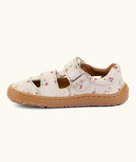 Side of Froddo barefoot children's sandal in pink with flowers showing a velcro fasteners looped through the eyelet