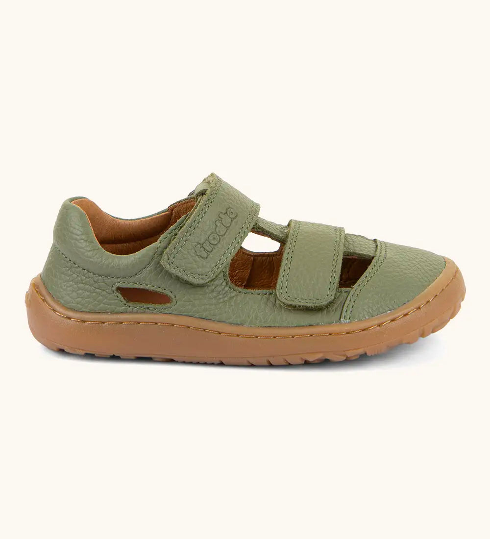 Froddo barefoot children's sandal in green. A natural leather low profile shoe showing 2 velcro fasteners and a rubber  sole