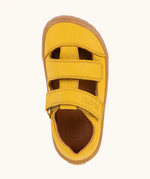Top view of Froddo natural leather barefoot children's sandal in yellow showing the 2 velcro strap fastener and insole detail