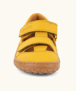 Front of the Froddo natural leather barefoot children's sandal in yellow showing 2 velcro fasteners and a brown rubber sole
