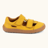 Side of  Froddo's natural leather barefoot children's sandal in yellow showing 2 velcro fasteners and a brown rubber sole