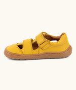 Froddo barefoot children's sandal in yellow showing a velcro fasteners looped through the eyelet and a brown rubber sole