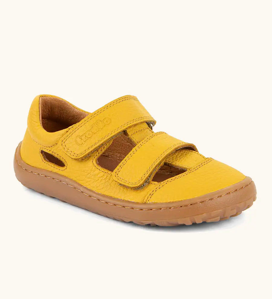 Froddo natural leather barefoot children's sandal in yellow showing 2 velcro fasteners and a brown rubber sole