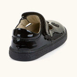 Back of Froddo barefoot kids school shoe in black patent material showing padded ankle support