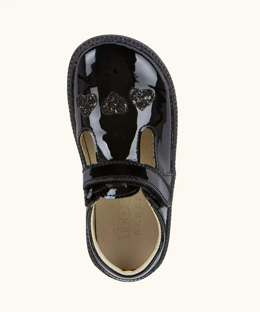 Top view of the Froddo barefoot kids school shoe in black patent material showing heart decoration on the front