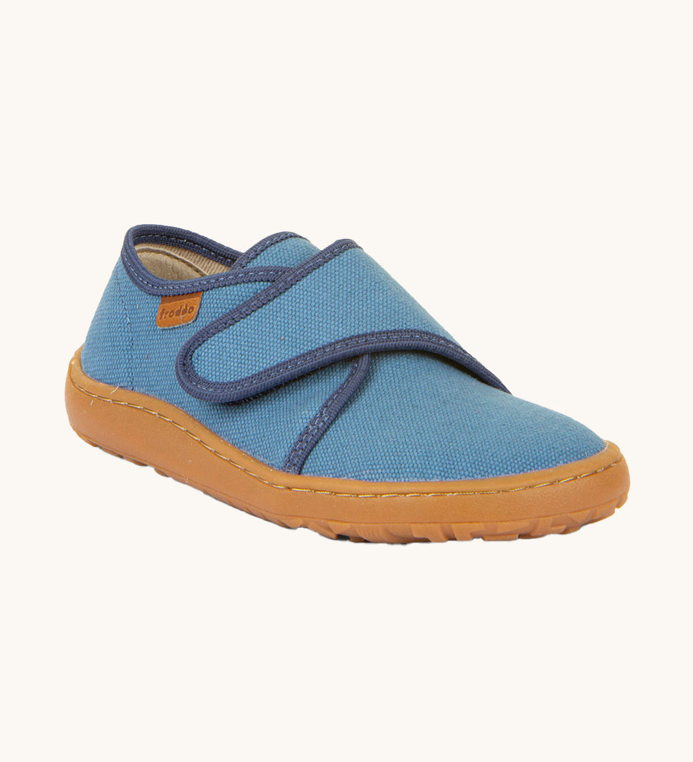 Froddo barefoot kids slipper in denim blue available at Babipur. A canvas style slipper shoes with a velcro fastener for a secure fit and a dark brown grippy sole
