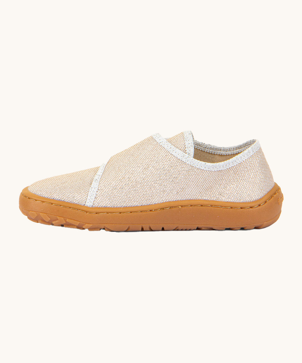 A side image of the Froddo barefoot kids slipper in gold shine available at Babipur showing the velcro fastener detail