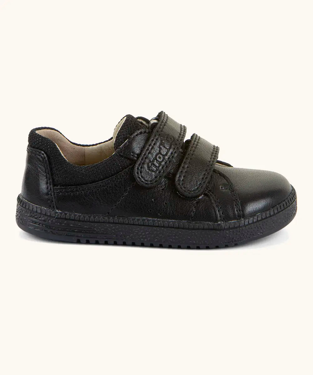 Side of Froddo barefoot school shoe in black with 2 front velcro straps and a padded ankle support