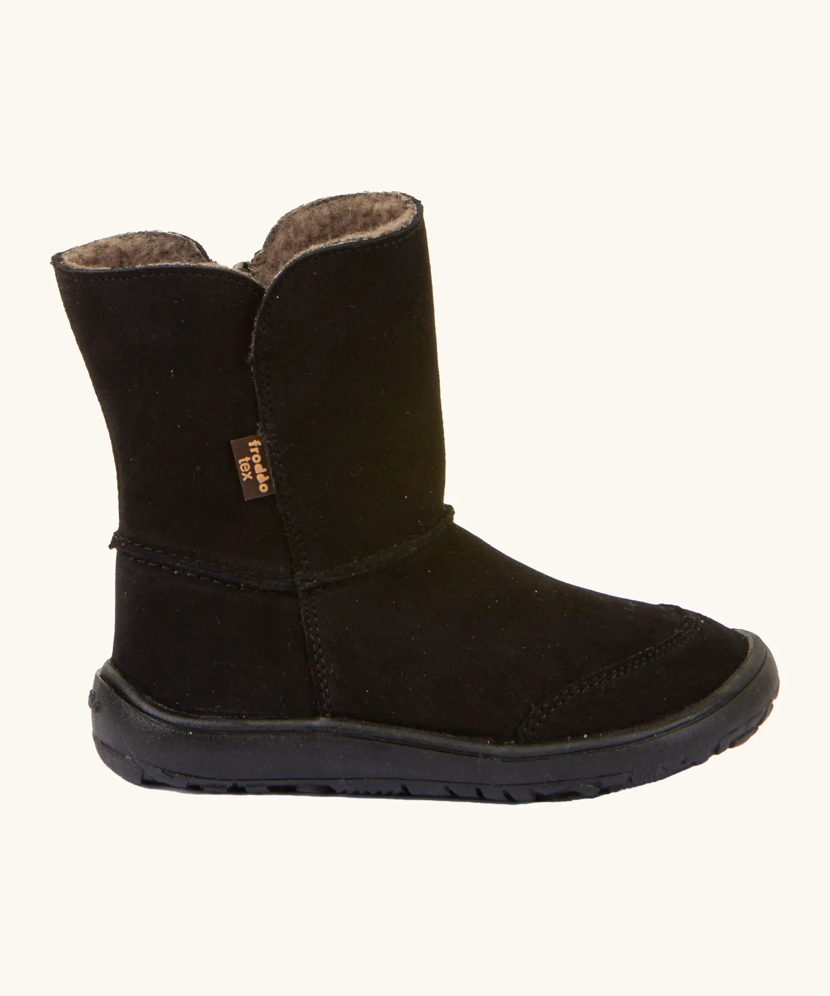 Side of Froddo barefoot kids suede tex boots in black with a fluffy fleece inner liner. Boot is a mid calf boot shape
