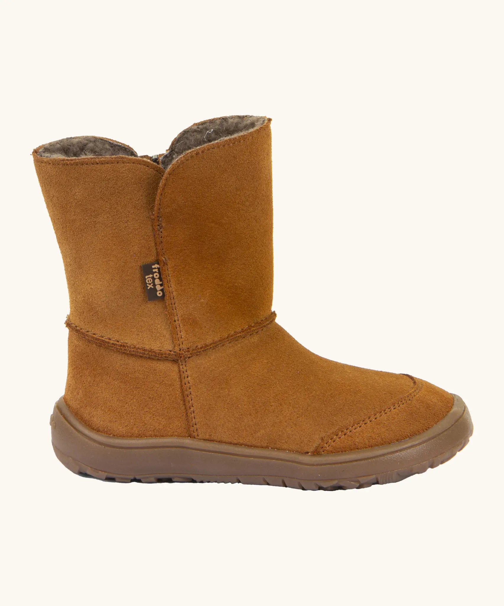 Side of Froddo barefoot kids suede tex boots in rusty brown with a fluffy fleece inner liner. Boot is a mid calf boot shape