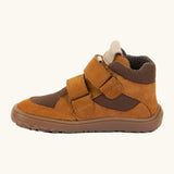 Side of the rusty brown Froddo barefoot kids suede TEX shoes showing padded ankle support and velcro straps looped through the eyelets