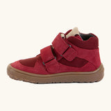 Side of the red Froddo barefoot kids suede TEX shoes showing padded ankle support and velcro straps looped through the eyelets
