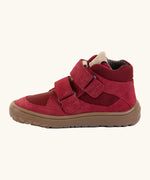 Side of the red Froddo barefoot kids suede TEX shoes showing padded ankle support and velcro straps looped through the eyelets