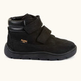 Side of Froddo barefoot Zuru tex kids shoe in black. A natural leather shoe with 2 velcro fastener and padded ankle support