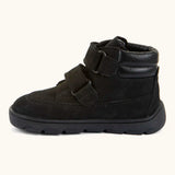 Side of Froddo barefoot Zuru tex kids shoe in black. A natural leather shoe with 2 velcro fastener looped through eyelets