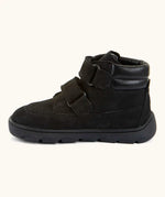 Side of Froddo barefoot Zuru tex kids shoe in black. A natural leather shoe with 2 velcro fastener looped through eyelets