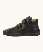 Froddo barefoot leather school boots in black available at Babipur. Showing the veclro strap detail trough the loops. 