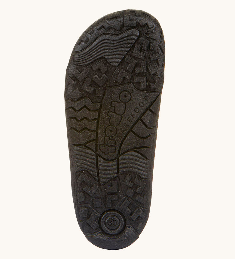 A close up of the black rubber sole detail on the Froddo barefoot leather school boots available at Babipur.