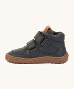 A side image of a Froddo barefoot Autumn children's shoe in navy available at Babipur showing the 2 velcro fastener for a secure fit, padded ankle and the dark brown grippy sole