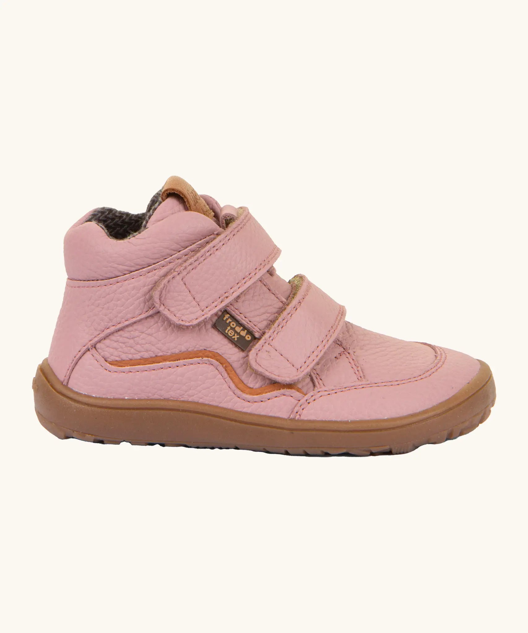 Side of Froddo barefoot tex kids autumn natural leather ankle boots in pink showing Velcro straps fully fastened and brown flexible rubber sole