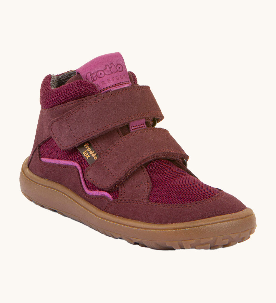 Froddo barefoot tex kids autumn shoes in bordeaux pink available at Babipur. A soft ankle high shoe in purple with a light brown rubber sole. Features two velcro straps for a secure fit 