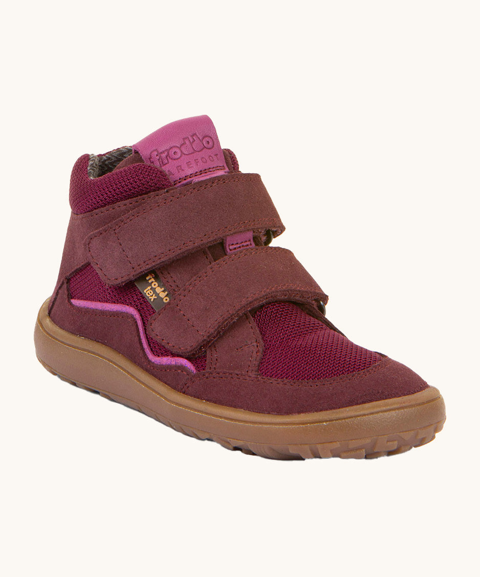 Froddo barefoot tex kids autumn shoes in bordeaux pink available at Babipur. A soft ankle high shoe in purple with a light brown rubber sole. Features two velcro straps for a secure fit 