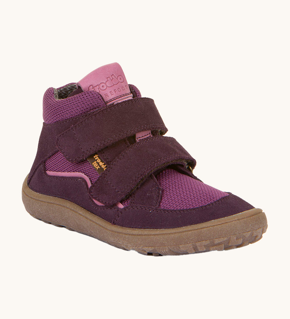 Froddo barefoot tex kids autumn shoes in purple available at Babipur. A soft ankle high shoe in purple with a light brown rubber sole. Features two velcro straps for a secure fit 