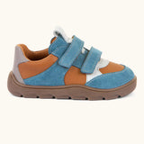 Side of Froddo barefoot zeru Spring kids shoes in blue, brown and grey. Showing 2 blue velcro fasteners, pull tab on tongue and brown grippy sole
