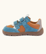Side of Froddo barefoot zeru Spring kids shoes in blue, brown and white. Showing 2 blue velcro fasteners looped through eyelets
