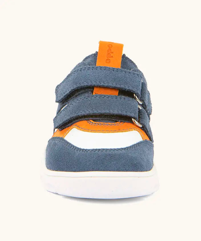 Front of Froddo barefoot zuru Spring kids shoe in blue and white showing the velcro fasteners and orange pull tab on the tongue