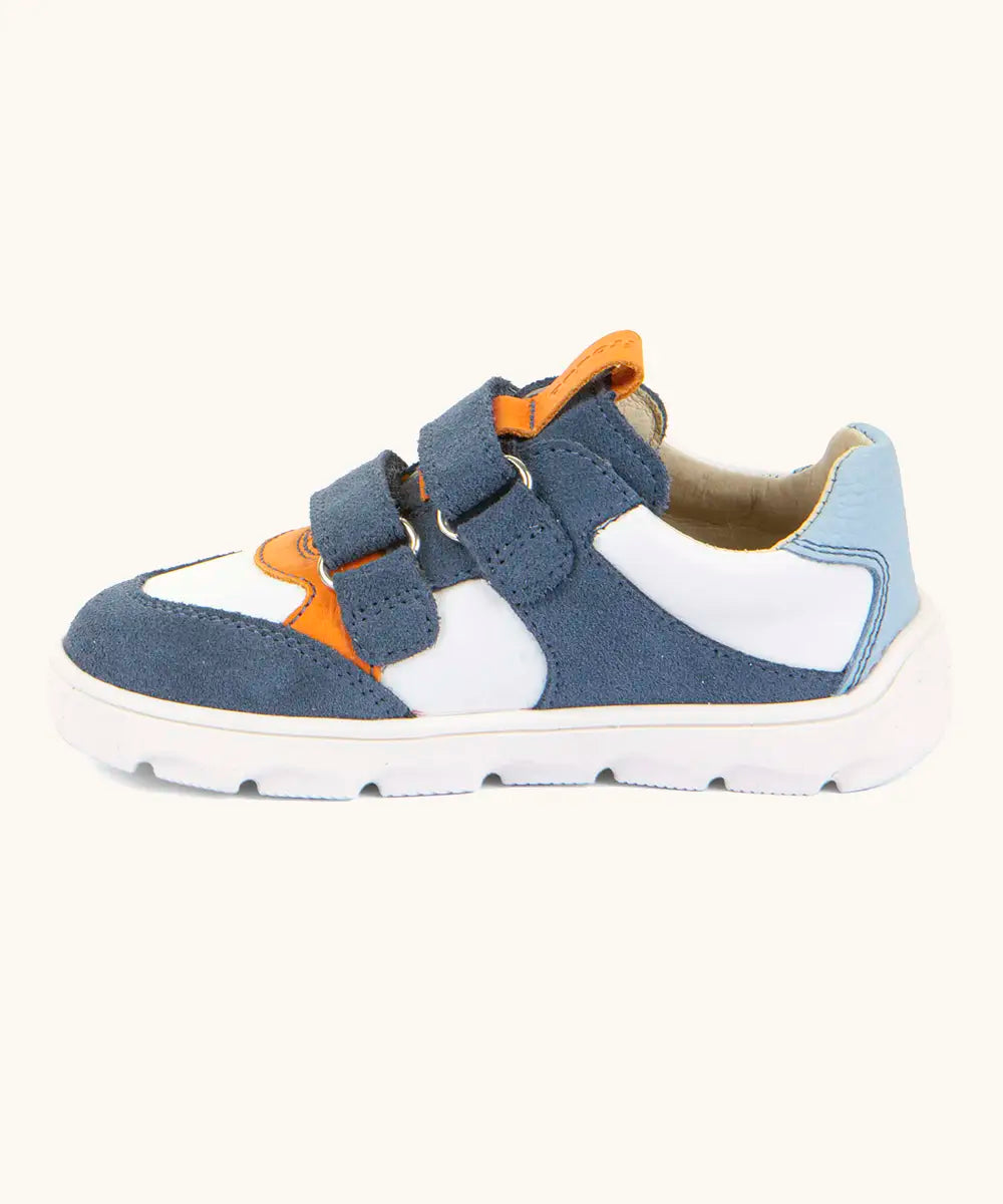 Side of Froddo barefoot zeru Spring kids shoes in blue and white. Showing 2 blue velcro fasteners looped through eyelets and orange pull tab on tongue