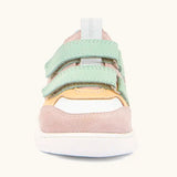 Front of Froddo barefoot zuru Spring kids shoe in pink and white showing the velcro fasteners and pull tab on the tongue