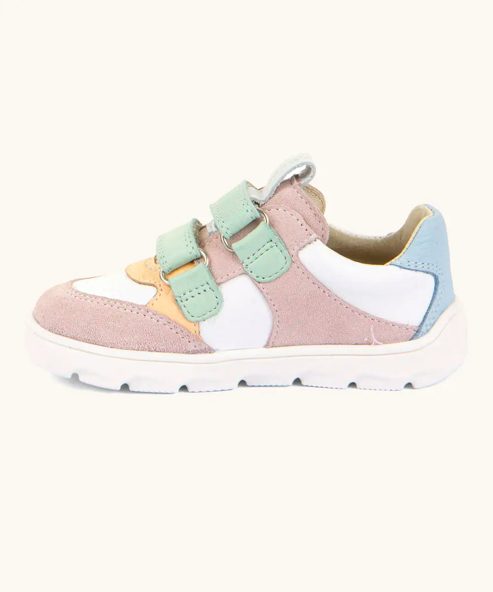 Side of Froddo barefoot zeru Spring kids shoes in pink and white. Showing 2 green velcro fasteners looped through eyelets