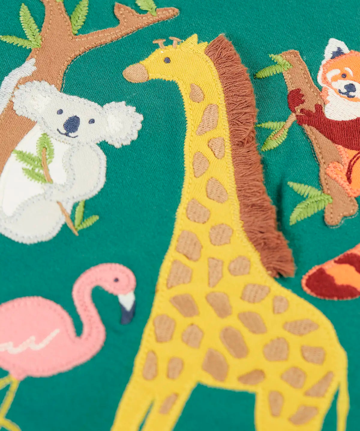Frugi GOTS 100% organic cotton top in dark green showing a close up of the playful koala, flamingo, giraffe and red panda applique 