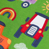 Frugi GOTS 100% organic cotton kids long sleeve top in green showing a close up of the playful tractors  appliques 