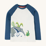 Frugi Alfie Raglan Top - Navy Blue/Anteater. An organic cotton, long sleeve, raglan top with navy blue sleeves, a white body and a large anteater applique on the front