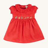 Frugi Amilie Party Dress - True Red/Robin. Made from soft organic cotton cord, in Red with a Robin embroidered on the front, this dress features a smocked panel with  a frill collar and gathered sleeves and poppers on the back for easy dressing.