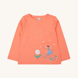 Frugi Anna Applique Top - Cantaloupe/Fairy. Made from orgaic cotton, this long-sleeved Anna Appliqué Top from Frugi, in Cantaloupe, has a Fairy appliqué on the front