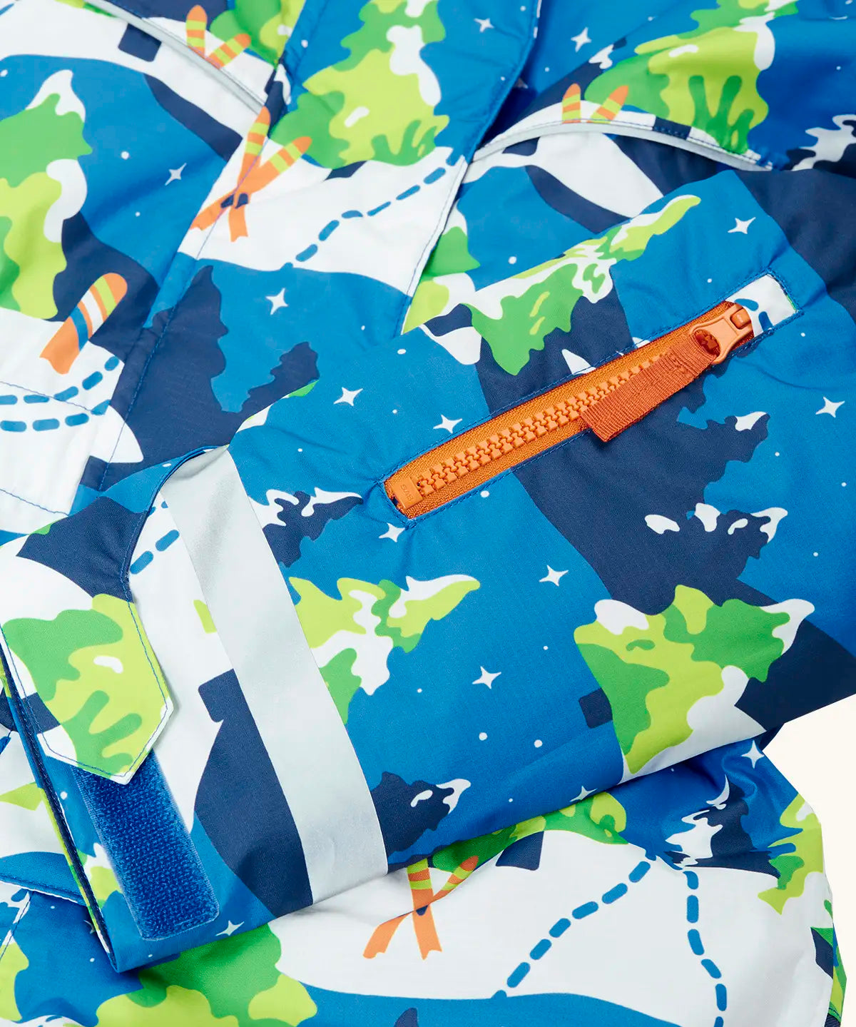 Frugi starry slopes any weather all in one hooded outfit showing close up of small zipped pocket on the arm