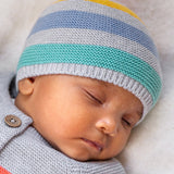 A baby wearing the Frugi Harlen Knitted Hat - Grey Marl Stripe