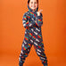 Frugi big organic cotton snuggle suit in blue with rainbow rocket and planet design, worn by child with hood up.