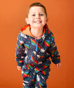 Child wearing Frugi's GOTS organic cotton big hooded snuggle suit in navy with repeating flying rocket prints and a orange inner liner 