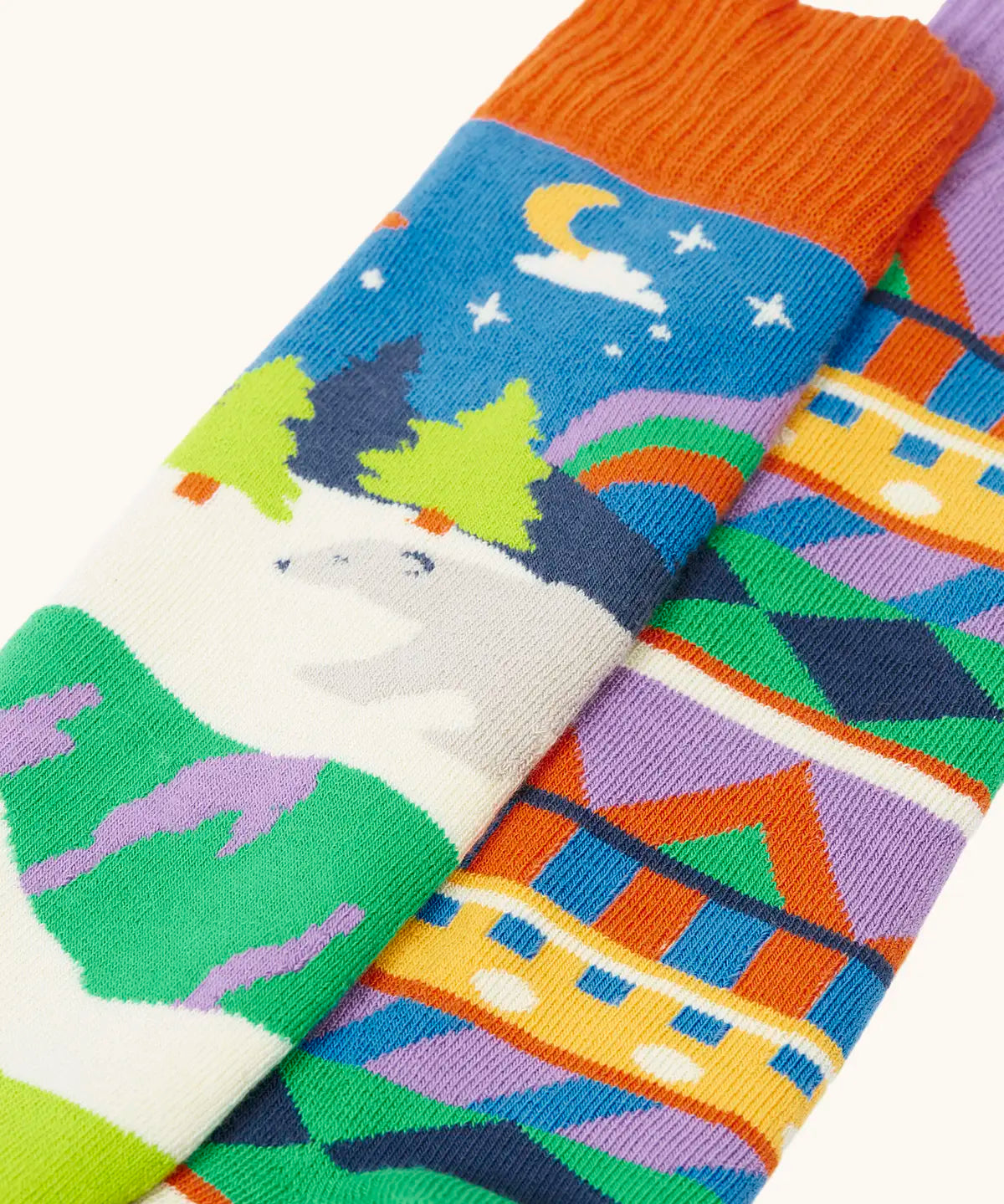 Frugi GOTS organic cotton 2 pack of socks laid flat showing a winter inspired fairisle design and a polar scene design sock