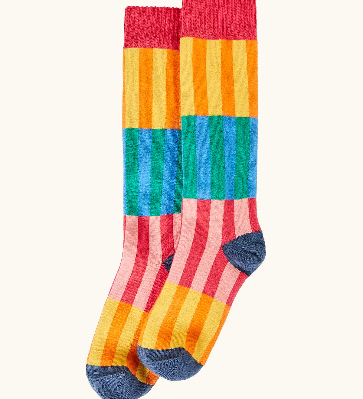 Frugi GOTS organic cotton socks showing   colourful striped design and a navy heel and toe and coral ankle cuff 